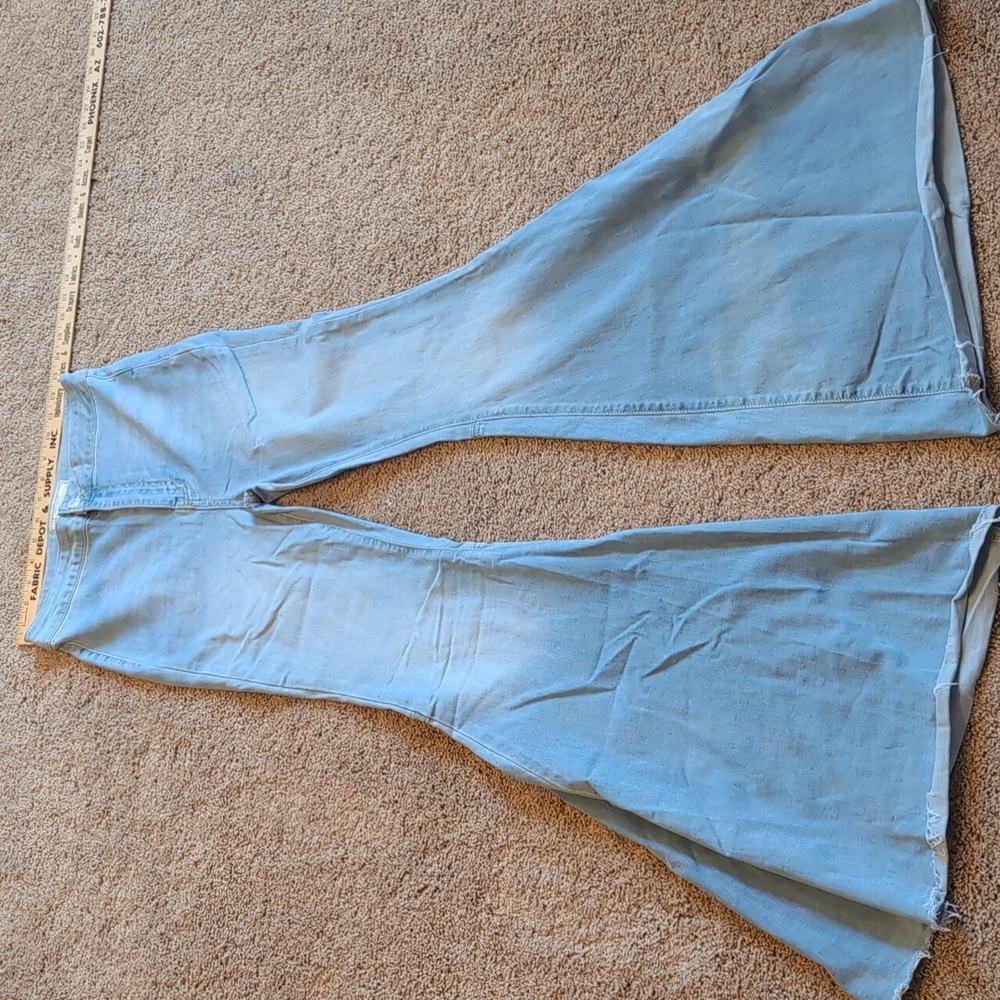 Free People jeans. Size 27R. Large bell bottom. Light wash.